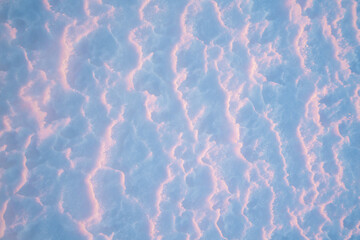 Sunset light covers the snow