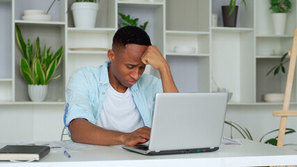 Tired depressed bored african businessman frustrated by business failure