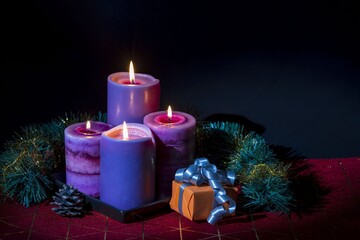 View of Christmas burning candles and decoration objects. Postcard. Christmas and New Year holidays concept background.