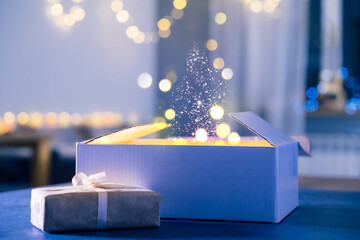 Magic background with gifts, dust and light for Christmas