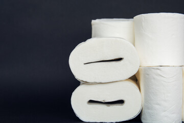 toilet paper rolls wrapped in gift paper like an expensive present