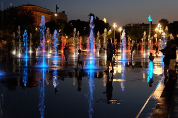 Travel: Children playing in the fountain in the center of Nice