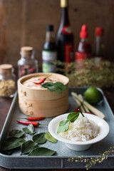 Asian Steamed White Rice Garnished with Fresh Kaffir Lime Leaves. Cooking Ingredients
