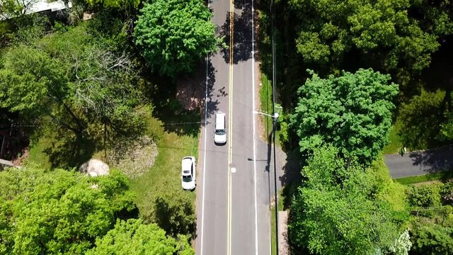 Bird's Eye Camera Tilt of a Suburban Country Road