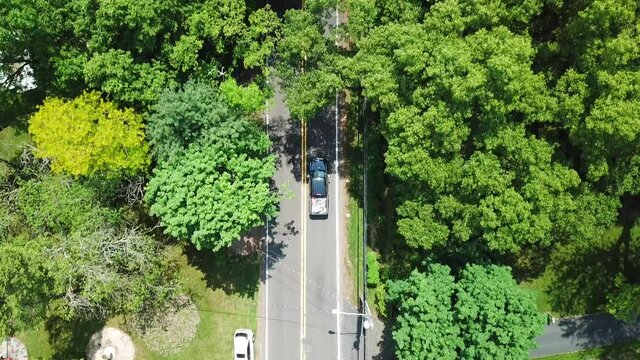 Bird's Eye View of Moving Cars on a Suburban Country Road