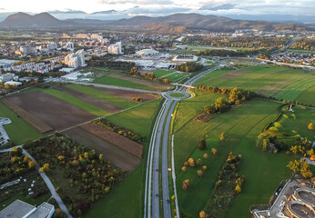 road with roundabout traffic top aerial drone view
