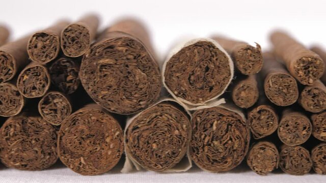 cigarillo and cigars in black background 4k