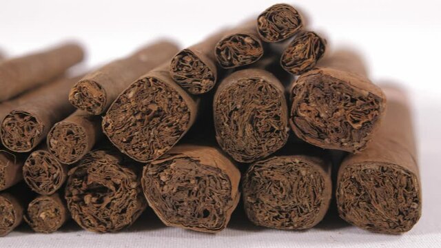 cigarillo and cigars in black background 4k