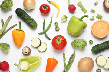 Flat lay composition with fresh vegetables on white background