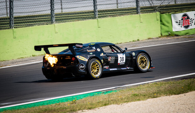 Flames From Exhaust Pipe Of Lotus Exige Racing Car Engine Power Supercar