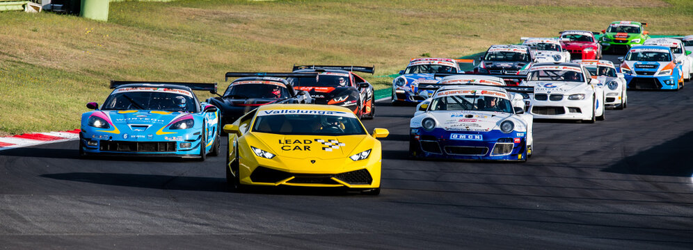 Lamborghini lead car heading motorsport racing group of touring cars