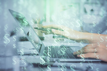Multi exposure of woman hands typing on computer and financial graph hologram drawing. Stock market analysis concept.
