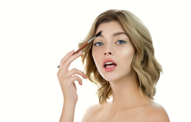 Obraz premium Beautiful young woman with clean perfect skin shapes her brow.