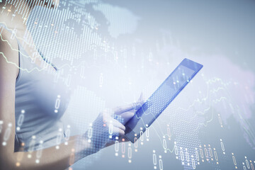 Double exposure of forex chart sketch hologram and woman holding and using a mobile device. Financial market concept.