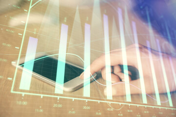 Double exposure of forex chart sketch hologram and woman holding and using a mobile device....