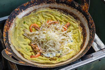 Sizzling Vietnamese crusty crepe with shrimp and vegetable- Banh Xeo