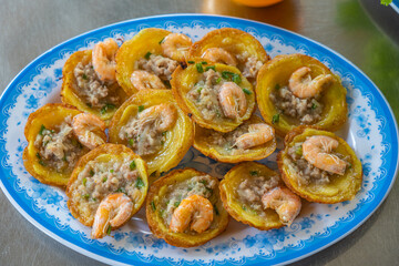 Plate of Vietnam styled fried shrimp pancakes at food vendor