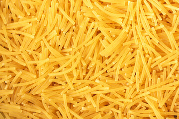 Dry vermicelli pasta backround. Close up view.