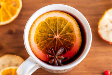 German tradition winter Christmas market new year holidays festival drink tea Gluhwein Mulled sweet hot warm red Wine with spices citrus aromatic cinnamon star anise