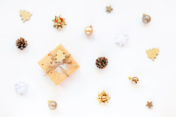 Christmas gift in a box and baubles on white isolated background, texture. Top view