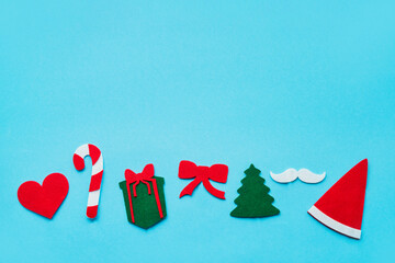 Christmas stick costume props on bright blue background. Top view, copy space.