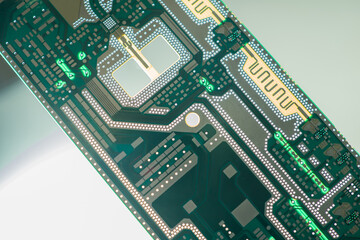 Printed circuit Board lies diagonally on the table. Gray-green background of a printed circuit...