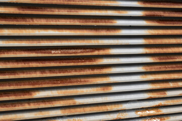 Rusty corrugated metal wall. Rusty metallic background