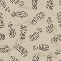 Grunge footprints Seamless pattern. Hand drawn doodles shoe tracks - Vector illustration. Gray background.