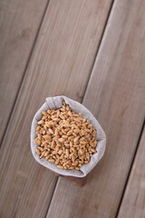 A small sack full of harvested wheat