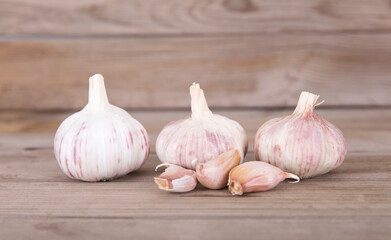 Three heads of garlic and a few peeled garlic cloves