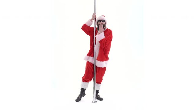 Santa Claus is dancing on pole. Lustful arabic young Santa with black beard dances rotates on pole on white background