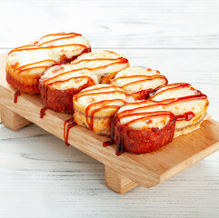 Sushi set with acne on the wooden desk. Sushi rolls - Japanese food.