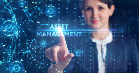 Business, Technology, Internet and network concept. Young businessman working on a virtual screen of the future and sees the inscription: Asset management