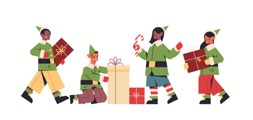 green elves in costumes preparing gifts mix race boys girls santa helpers happy new year merry christmas holidays celebration concept full length horizontal vector illustration