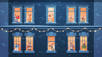 people in santa hats holding gifts mix race neighbors standing in window frames new year christmas holidays celebration self isolation concept building house facade horizontal vector illustration