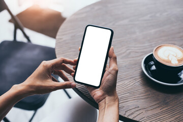 cell phone blank white screen mockup.woman hand holding texting using mobile on desk at office.background empty space for advertise.work people contact marketing business,technology