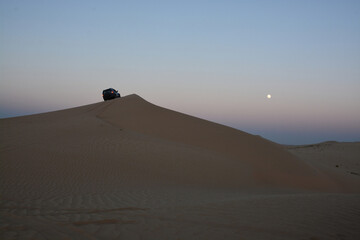 Desert moon and beautiful adventure in the dunes 