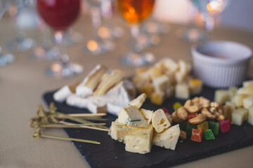 Beautifully decorated catering banquet table with different food snacks and appetizers on corporate christmas birthday party event or wedding celebration