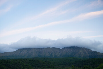 Enchanting view of popular landmark Uritorco hill, valley and green forest at sunset, in Capilla...