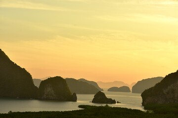 Sea view There are many islands in the early morning, the sky is beautiful golden yellow light.	