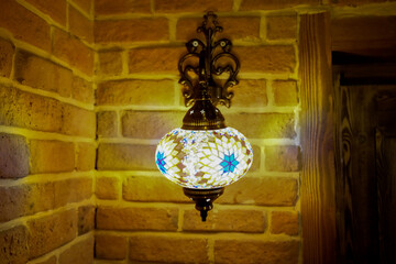 Vintage wall lamp with eastern ornates on it.