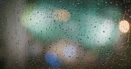 Heavy rain on the glass at night
