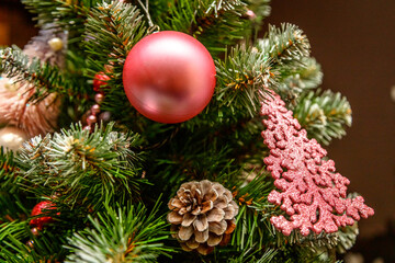 Christmas decorations, red lights, on the Christmas tree, close-up, selective autofocus. Conceptual meeting, Happy New Year