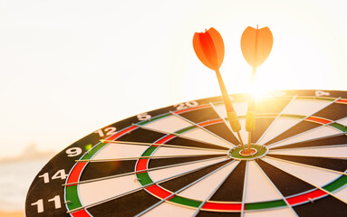 Closeup the dart arrow hit center on Bullseye(bull's-eye) of a dartboard is a target of challenge...