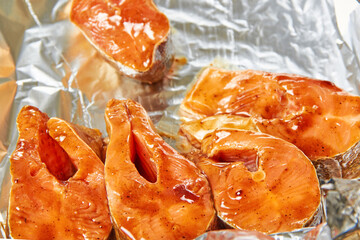 Fish in a marinade of teriyaki sauce before baking