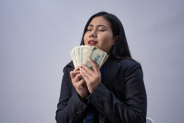 Life style portrait of a young Asian business woman in various poses, studio shot, business concept, isolated background