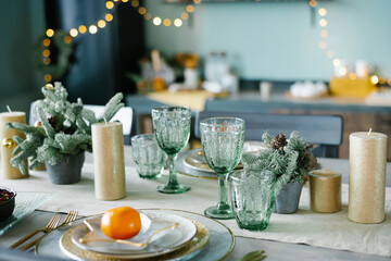 Beautiful table setting with Christmas decorations in living room