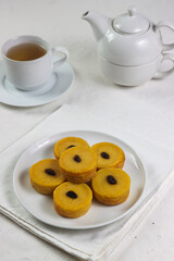 Kue lumpur or Javanese Pancake is javanese traditional pancake made from pumpkin and coconut milk, topped with raisin.