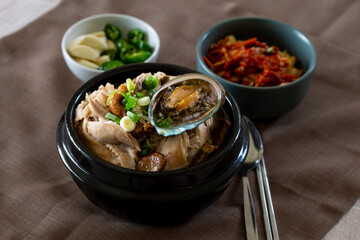 Ginseng chicken soup with abalone which is called Jeonbok Samgyetang