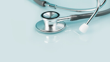 Medical or healthcare concept banner. stethoscope on blue desk. Doctor appointment or checkups schedule, PPE. Copy space.